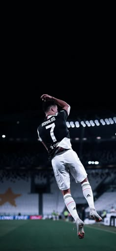 a baseball player jumping in the air to catch a ball