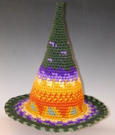 Judy has made these one of a kind Witch Hats for the pure joy of it for years. These are her evening projects to relax and have fun with color and pattern, her two loves! This design is made custom for you, you just select and send a color pallet and turn her loose. Check the stitch detail on these. Judy uses a tight uniform stitch to create a firm hat that stands on its own. She includes a soft wire in the edge so you can sculpt the brim to fit your mood. Each hat is unique, and average over 80 Handmade Funky Multicolor Hats, Handmade Multicolor Funky Hats, Funky Multicolor Handmade Hats, Whimsical Multicolor Hats For Gifts, Fun Multicolor Mini Hats With Curved Brim, Whimsical Handmade Multicolor Costume Hats And Headpieces, Whimsical Handmade Multicolor Crochet Hat, Whimsical Multicolor Handmade Crochet Hat, Handmade Multicolor Crochet Hat Whimsical Style