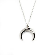 Crescent moon charm necklace, beautifully polished to shine, this pendant is a must have piece, its clean and minimalistic appearance makes it casual yet elegant, therefore it is a perfect match to a white T shirt or a black evening dress . Material: 925 Sterling Silver Dimensions: L 24mm , W 21mm Comes on a matching chain. All of our jewellery packed in our labeled gift box Let us know if you have any questions, we would love to help you. For more of our necklaces please click here: https://www Tusk Necklace, Crescent Moon Necklace Silver, Fake Gauge Earrings, Black Evening Dress, Packing Jewelry, Crescent Moon Necklace, Celestial Jewelry, Necklace Minimalist, Charm Pendant Necklace