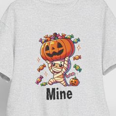 This cute funny Mummy Halloween T-Shirt gives off a playful and festive vibe, perfect for Halloween enthusiasts and those who enjoy a touch of humor in their wardrobe. It is ideal for casual wear during Halloween parties, trick-or-treating, or just adding a touch of spookiness to everyday outfits. Product features - Medium fabric made of 100% cotton for year-round comfort - Classic fit for a comfy, relaxed wear - Crew neckline for a neat, timeless look - Tear-away label for a scratch-free experi Playful Halloween T-shirt With Cartoon Print, Funny Halloween T-shirt With Character Print, Playful Crew Neck Tops For Halloween, Funny Halloween Character Print T-shirt, Novelty T-shirt For Costume Party With Short Sleeves, Fun Short Sleeve T-shirt For Costume Party, Novelty Short Sleeve T-shirt For Costume Party, Halloween Playful Short Sleeve T-shirt, Playful Short Sleeve T-shirt For Halloween