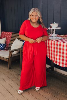 - Trendy and easy to style, this adorable jumpsuit is perfect for a sunny backyard BBQ! - Soft unlined material - A round neckline - Short sleeves - An elastic waistline - Functional side pockets - A relaxed silhouette that ends in wide hemlines Red Solid Color Jumpsuits And Rompers For Spring, Casual Red Jumpsuits And Rompers, Casual Red Solid Color Jumpsuits And Rompers, Casual Red Jumpsuit And Romper, Red Solid Color Jumpsuits And Rompers For Summer, Red Jumpsuits And Rompers For Summer, Red Short Sleeve Jumpsuits And Rompers With Pockets, Red Jumpsuits And Rompers With Pockets, Summer Short Sleeve Jumpsuits And Rompers With Elastic Waistband