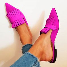 These fuchsia mules feature a chic pointy toe and trendy fringe accent. Crafted from supple vegan suede, these flats offer both comfort and style, making them a versatile addition to your wardrobe. Perfect for any occasion, these shoes ensure a secure fit and a fashion-forward statement. HandcraftedUS sizing. Fits true to size. Chic Pointy Toe Design: The fuchsia mules boast a sleek and stylish pointy toe, offering a fashionable touch to any outfit. Supple Vegan Suede Material: Crafted from high-quality vegan suede, these flats offer comfort and durability, perfect for all-day wear. Fringe Accent: Adorned with a trendy fringe detail, adding a playful and eye-catching element to your ensemble. Versatile Style: Ideal for various occasions, these shoes transition seamlessly from casual to sem Chic Pink Flat Mules, Trendy Suede Pointed Toe Mules, Pink Pointed Toe Flats For Spring, Chic Pink Pointed Toe Flats, Chic Pink Pointed Toe Mules, Summer Suede Pointed Toe Flats, Pink Suede Flats, Pointed Flats Shoes, Fringe Shoes