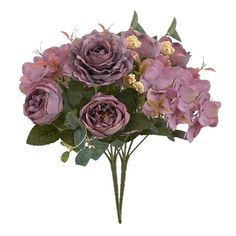 a bunch of flowers that are sitting in a vase on a white surface, with green leaves