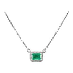 This is part of Chairish’s Fine Jewelry assortment.  Natural Emerald Diamond Halo Chain Necklace with in 18K Gold studded with octagon cut emerald and round cut diamonds. This stunning piece of jewelry instantly elevates a casual look or dressy outfit.  Emerald enhances intellectual capacity of the person. Designed with a octagon cut emerald set in center with layer of diamonds studded around it making a stunning delicate necklace. This is a perfect Unique Gift, Bridal Shower Gift, Secret Santa Formal Emerald Necklaces With Single Cut Diamonds, Elegant Emerald Diamond Cut Necklace, Elegant Jewelry With Bezel Setting Rectangular Pendant, Elegant Jewelry With Rectangular Pendant Cable Chain, Elegant Jewelry With Cable Chain And Rectangular Pendant, Luxury Emerald Cut Emerald Necklace With Diamond Accents, Elegant White Gold Emerald Cut Necklace, Elegant Octagon Diamond Necklace, Elegant Octagonal Diamond Necklace