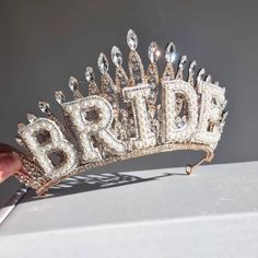 a bride's tiara with the word bride written on it