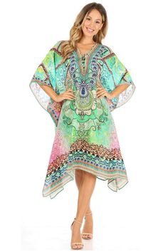 This caftan dress cover up features a beautiful handmade cut. It has a beautiful multi toned tribal pattern print with a v-neck and rhinestone embellishments around the neckline. The dress is long and tall, and has adjustable drawstrings at the neckline that can be left undone or tied as desired. The dress is very lightweight and airy. Poncho Outfit, Rhinestone Embellishments, Caftan Dress, Cut It, Dress Cover, Embellishments, The Dress, Cover Up, V Neck