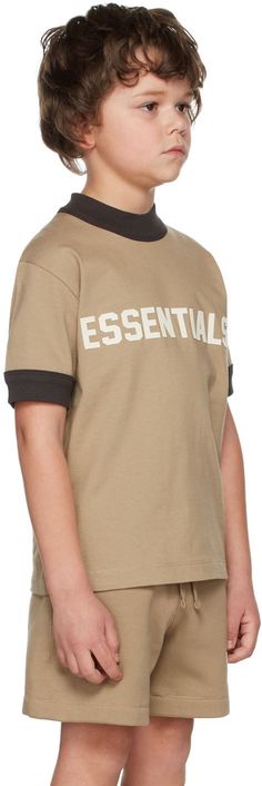 Short sleeve cotton jersey T-shirt in tan. Logo flocked in off-white at front. · Rib knit crewneck collar and cuffs · Hand wash Model measures 49 / 124.5 cm tall and wears size S. Please note that this item may not be shipped within the EU. Supplier color: Oak Size: child's height XXS: 36-41 / 91.5-104 cm XS: 41-44.5 / 104-113 cm S: 44.5-48.5 / 113-123 cm M: 48.5-53 / 123-134.5 cm L: 53-58 / 134.5-147.5 cm XL: 58-62 / 147.3-157.5 cm XXL: 63-67 / 157.5-170.2 cm Fear Of God Essentials, Fear Of God, Knit Crewneck, Home Products, Collar And Cuff, Jersey T Shirt, Kids Clothing, Sleeve Cotton, Rib Knit