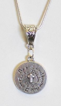 This is a silver tone With God All Things Are Possible pendant on a sterling silver plated snake chain to represent the Bible verse of Matthew 19:26. This is a double sided pendant with the verse on both sides. This pendant is available on your choice of 16, 18, 20, 22, 24, 26, 28 or 30 inch sterling silver plated snake chain. The pendant is also available for individual purchase if you have another chain that you would like to wear it on. This jewelry item has small parts and is not intended fo Inspirational Silver Charm Necklace With Round Pendant, Inspirational Nickel-free Silver Charm Necklaces, Inspirational Silver Nickel-free Charm Necklaces, Inspirational Nickel-free Silver Necklace, Inspirational Silver Round Pendant Jewelry, Inspirational Silver Pendant Jewelry, Inspirational Adjustable Silver Charm Necklace, Adjustable Silver Inspirational Charm Necklace, Inspirational Engraved Silver Charm Necklaces