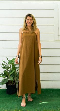 "Organic Cotton Dress * Bohemian Style Dress  * One Size Fits Most (US Women's XS-L) * Organic Cotton * 2 Side Pockets * Adjustable Ties Back Straps * Elastic Back * Bust up to 48\" * Length with Hem 46\" * Suitable for any occasion * Great gift for yourself or your loved ones" Unlined Bohemian Maxi Dress, Brown Maxi Dress With Side Slits, Casual Brown Maxi Dress For The Beach, Bohemian Unlined Maxi Dress, Brown Cotton Maxi Dress For Vacation, Bohemian Brown Cotton Dress, Brown Cotton Maxi Dress, Bohemian Beach Dresses With Side Slits, Brown Cotton Sundress Maxi Dress