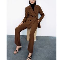 High-Waist Trousers With Front Pockets And False Rear Welt Pockets. Flared Both. Front Fastening With Metal Hook, Inside Button And Zip Fly. Solid Color Fall Pantsuit With Straight Pants, Fall Solid Pantsuit With Straight Pants, Solid Straight Pantsuit For Fall, Fall Season Solid Color Straight Pantsuit, Tailored Bottoms With Button Closure For Fall, Wide Leg Pantsuit With Button Closure For Work, Tailored Fall Bottoms With Button Closure, Trendy Fitted Office Pantsuit, Fitted Fall Suit Trousers