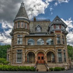 an old victorian style house with a steeple on the roof