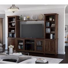 a living room with a large entertainment center