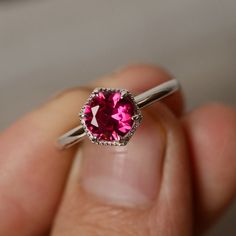 This is a gorgeous handmade creation. Its beauty is its simplicity & Elegance. The 7mm round cut Lab ruby is crafted in solid sterling silver and with rhodium plated. All item is sent in a beautiful gift box You can realize more lovely stuff clicking the link https://www.etsy.com/shop/knightjewelry?refshopsection_shophome_leftnav Please leave the correct address and you phone number for delivering successfully. 14k White Gold Ruby Ring With Halo Setting, Elegant Ruby Ring With Halo Setting, Timeless Sapphire Ring Gift, Elegant Platinum Ruby Ring With Round Cut, Elegant White Gold Ruby Ring, Sterling Silver Timeless Birthstone Ring, Timeless Sterling Silver Birthstone Ring With Gemstone, Elegant Brilliant Cut Ruby Ring Gift, White Gold Ruby Ring In Platinum