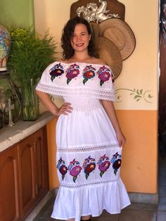 Beautiful traditional Mexican peasant dress, embroidered with bright colors of silk thread. Dress with spring at the waist and lace details to show off on any occasion. The embroidery of each dress is unique, so the colors may vary. Mexican textile art has centuries of history and creativity throughout the country. Mexico is recognized as one of the leading countries with a beautiful artistic production in the textile world, miraculous hands of talented artisans from different states of the coun Bohemian Maxi Dress For Traditional Ceremonies, Folk Style Floral Embroidered Dress For Ceremonies, Bohemian Embroidered Maxi Dress For Traditional Ceremonies, Peasant Style Embroidered Dress For Festival, Folk Dresses With Multicolor Embroidery For Traditional Ceremonies, Peasant-style Embroidered Dress For Festival, Folk Style Dress With Multicolor Embroidery For Traditional Ceremonies, White Bohemian Embroidered Dress For Traditional Ceremonies, Traditional Dresses For Spring Ceremonies