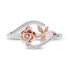 an open rose ring with diamonds on the sides and two leaves in the middle, sitting on