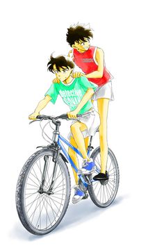 two people riding on the back of a bike