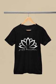 "Elevate your sense of calm and tranquility with our \"Just Breathe Lotus Shirt \" This beautifully designed shirt is the perfect addition to your yoga and meditation wardrobe. Its delicate dandelion imagery and the soothing \"Just Breathe\" message create an atmosphere of mindfulness and serenity, making it an excellent gift for yoga teachers and enthusiasts. Key Features: ✨ Inspiring Design: The 'Lotus T-shirt features a stylish and artistic typography arrangement that playfully emphasizes the Typography Arrangement, Artistic Typography, Yoga And Meditation, Yoga Shirt, Aesthetic T Shirts, Encouragement Gifts, Yoga Teachers, Kindness Shirts, Yoga Gifts