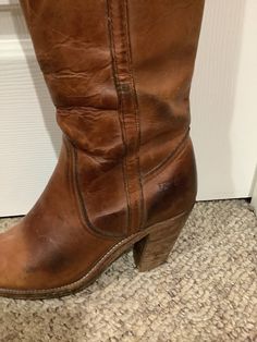 This nice vintage Frye chestnut distressed patina tall boho wood stacked heel boots size 5.5 size 6.5. As you can see from the pictures of the heels/ shows wear on back tip of heel. Will need a heel guard at some point in time. Pls look at the coloring of the boots distressed and broken in patina leather/the size marked inside is 6.5 inside. But vintage shoes depending on the designer can tend to run smaller. So pls compare to the measurements I give you. Ok vintage cond. Vintage Patina Boots With Round Toe, Distressed Brown Boots For Fall, Brown Wide Calf Mid-calf Boots With Stacked Heel, Brown Patina Boots For Fall, Brown Boots With Patina For Fall, Rugged Brown Boots With Patina, Brown Snip Toe Boots With Stacked Heel, Brown Distressed Moto Boots With Round Toe, Brown Snip Toe Heeled Boots With Stacked Heel