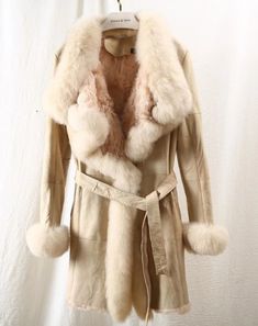 Winter White Sheepskin Outerwear For Winter, Winter White Sheepskin Outerwear, Winter White Sheepskin Outerwear With Faux Fur Trim, Beige Sheepskin Fur Coat For Fall, Cream Sheepskin Outerwear With Faux Fur Trim, Luxury Cream Fur Coat For Winter, Luxury Beige Outerwear With Faux Fur Lining, Winter Sheepskin Outerwear With Faux Fur Trim, Luxury Winter Fur Coat For Cold Weather