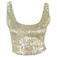 Presenting an exquisite off-white Ralph Lauren sequin crop tank top from the 1990s. This dazzling top features iridescent sequins, a scoop neckline, and a low scoop back, adding a touch of brilliance to its design. The perfect sparkly addition to any collection, this vintage Ralph Lauren crop top is a must-have! Approximate measurements: Size - M Shoulder to hem: 16" Bust: 32 - 36" Waist: 28 - 32" 85% Polyamide, 15% Spandex East Coast Style, Gucci Sweater, Glitter Top, Silk Tank Top, The 1990s, Ralph Lauren Purple Label, Glitter Bow, Crop Tank Top, Long Sleeve Knit Tops