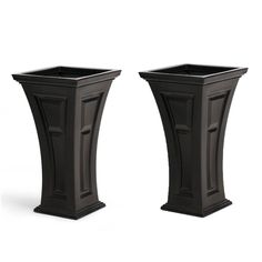 two black planters sitting next to each other