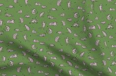 a green background with small white animals on it