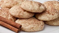 cinnamon sugar cookies on a plate with cinnamon sticks