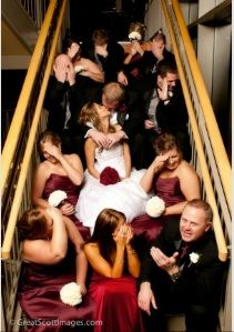 a group of people sitting on top of a stair case in front of each other