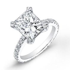 a princess cut diamond engagement ring with pave set shoulders