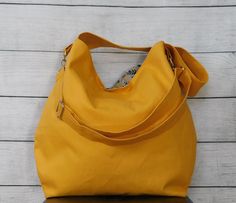 Here it is -- your basic everyday bag in a choice of 16 colors! This large slouchy hobo crossbody bag has a duck canvas exterior and a cotton interior. This bag is lightweight, versatile and durable. It would make a great bag for women of all ages too. Use this bag for school, work, travel, shopping or at the gym -- there's plenty of room for everything you need to carry! This canvas crossbody has a detachable adjustable strap, two large slip in and a zipper pocket on the inside, a magnetic snap Bag For School, Good Birthday Presents, Hobo Crossbody Bag, Travel Shopping, Duck Canvas, Work Travel, Everyday Bag, Bag For Women, School Work