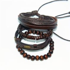 Elevate your wrist game with our 4pc braided leather brown bracelet set. Crafted from high-quality leather, these bracelets offer a stylish and versatile accessory option for any occasion. Whether you're dressing up for a night out or keeping it casual during the day, these trendy bracelets will add a touch of sophistication to your look. The set includes four different designs, allowing you to mix and match or wear them separately for a variety of looks. With their comfortable fit and durable construction, these bracelets are sure to become a staple in your accessory collection. Key Features; 👑 Stylish Designs: Each bracelet features a unique braided leather design, adding texture and visual interest to your wristwear. 💼 Versatile Accessory: Perfect for both casual and formal occasions, Masculine Brown Braided Bracelet For Gift, Masculine Brown Braided Bracelet As Gift, Casual Brown Leather Beaded Bracelets, Leather Bracelet For Men, Couples Accessories, Men's Bracelets, Brown Bracelet, Wrist Game, Luxury Wear