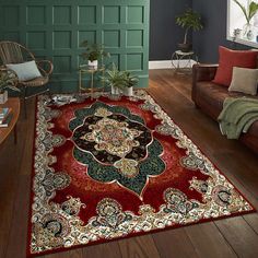 a living room filled with furniture and a red rug