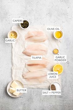 raw fish fillets laid out on parchment paper with ingredients to make the best recipe