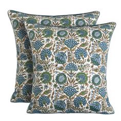 two pillows with blue and green floral designs on the front, one is made out of cotton