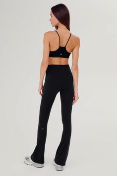 Our high waist Raquel shapes the waist line, elongates and slims on the body. The 4-way stretch supplex fabric is supportive and opaque for a confident workout. BEST FOR: yoga, CrossFit, barre, Pilates and gym workouts. Model is 5'10 and wears a size small, 32" length. High waisted for flattering shaping Below ankle length tight with flared leg Form fitting, true to size Smooth, chafe-free flatlock seams Available in 4 lengths Reflective 59 logo Barre Pilates, Flare Legging, Perfect White Tee, Elizabeth Cole, Top Collection, Sweater And Shorts, Black Leggings, Crossfit, Denim Dress