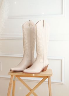 • Modeled on a size small • Color: Available in White or Beige • Material: Leather • Style: Boots • Sizing Tip: Runs true to size. Go with your typical go-to size. • Ships from Miami, Florida Beige Cowgirl Boots, Cream Cowgirl Boots, Cowgirl Boots Cream, Knee High White Cowgirl Boots, Light Tan Cowgirl Boots, Western Beige Embroidered Boots, Style Boots, Leather Style, Miami Florida