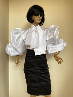 Straight cut satin blouse with a large bow tie and extremely puffy sleeves. Elasticity at wrists allowing to wear as a long or 3/4 sleeve. Made of stuff satin fabric SIZE CHARTSIZE S - US 6, UK 8, EU 36bust: bust around 34.5”/90cmWaist: waist around 27.5”/70cmHips: hips around 34.5”/90cmSIZE M - US 8, UK 10, EU 38bust: bust around 37.5”/95cmWaist: waist around 29.5”/75cmHips: hips around 37.5”/95cmSIZE L - US 10, UK 12, EU 40bust: bust around 39.5"/100cmWaist: waist around 31.5”/80cmHips: hips a Organza Sleeves Blouses, Puffy Blouse, Organza Tops, Puffy Sleeves Blouse, Black Satin Blouse, Bishop Sleeve Blouse, Satin Bluse, Organza Sleeves, Sleeves Ideas