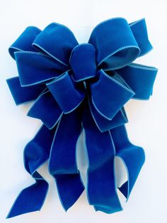 a large blue bow on a white background