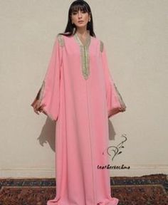 this stunning embroidered Moroccan kaftan is beautifully handcrafted by high skilled artisans from Morocco . both embroidery and beading are handmade . the fabric is so soft and comfy what makes it comfortable and elegant at the same time. this moroccan dress is easy to wear and will turn heads at any occasion, weddings, eid, baby shower, Ramadan ..etc *Product Describe Dress Style : kaftan THANK YOU VISIT AGAIN Traditional V-neck Abaya For Wedding, Bollywood Style Embellished Long-sleeved Abaya, Embellished Bollywood Abaya, Bollywood Style Embellished Long Sleeve Abaya, Traditional Pink Floor-length Abaya, Long Sleeve Dabka Work Kaftan For Eid, Traditional Floor-length Pink Abaya, Traditional Pink Maxi Length Abaya, Long Sleeve Kaftan For Party With Dabka Work