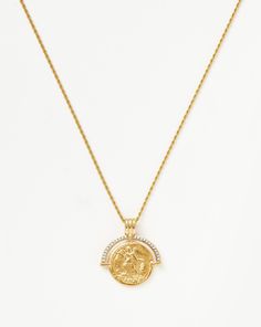 Lucy Williams Engravable Fortuna Arc Coin Pendant Necklace | 18ct Gold Plated/Cubic Zirconia. A Classic, Reimagined. Ancient Roman-Inspired Iconography Meets Contemporary Style in this Engravable Coin Pendant, Paired with a Delicate Chain. The Statement Arc Features White Cubic Zirconia Pave with Black Rhodium Prongs for a Vintage Feel. A Layering Essential, Wear with a Choker and Chains for Everyday Styling. Please Note: Engraving Items May Take 7-10 Working Days to Process. Chain Metal: 18Ct R Lucy Williams, Malachite Necklace, Coin Pendant Necklace, Cubic Zirconia Necklace, Delicate Chain, Star Studs, Black Rhodium, Recycled Gold, Coin Necklace