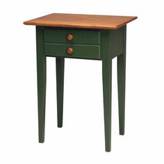 a small green table with two drawers