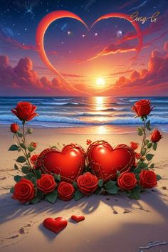 two heart shaped red roses sitting on top of a sandy beach next to the ocean