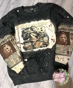 an old black sweater with the words halloween printed on it and two newspaper pieces next to it