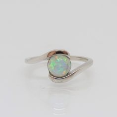 Vintage Sterling Silver White Opal Ring ....Marked 925...Total of weights 1.7grams...Size 7...Measure of Face 9.1MM...It's in very good condition. Classic Sterling Silver Round Bypass Ring, Classic Round Sterling Silver Bypass Ring, Silver Opal Ring With Round Stone, Hallmarked Sterling Silver Rings, Sterling Silver Opal Ring With Round Band, Sterling Silver Opal Ring With Round Stone, Sterling Silver Opal Promise Ring, Sterling Silver Opal Ring With Round Cut, Hallmarked Opal Ring For Anniversary