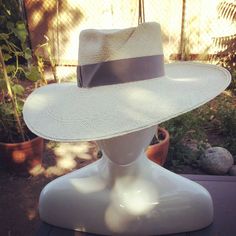 "This hand sculpted large brim fedora style is made from hand woven panama straw that is uv/sun protective and water resistant. The hat band is a 1.5\" Grosgrain ribbon with a two square folded detail. For other color hats I will send you options for hat bands. If you are interested in this style in another color, ask me and I will check with my suppliers. Each Corina Haywood Modern Millinery hat is hand made to order and ready to ship in 2-3 weeks.  Domestic Shipping costs are for 1-3 day shipp Dog Paw Pads, Hat Bands, Straw Fedora, Millinery Hats, Hat For Men, Hat For Man, Hat Band, Summer Hats, Straw Hat