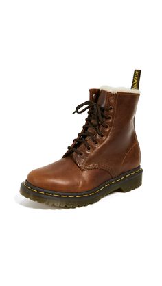 PRICES MAY VARY. Constructed on the iconic, durable Dr. Martens air-cushioned sole Good slip resistance and abrasion Made with a Goodyear welt: the upper and sole are heat-sealed and sewn together with a z-welt stitch Made with Orleans, a lightly-textured, soft and waxy leather with a pull-up effect Lined with warm faux fur Style Doc Martens, Red Doc Martens, Doc Martens Outfits, White Doc Martens, Doc Martens Style, Doc Martens Outfit, Dr Martens Womens, Cushioned Running Shoes, Doc Martens Boots