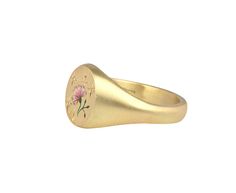 With its stunning, hand done details and subtle shimmer, this Cece Jewelry ring is a perfectly feminine take on the traditional signet ring. The matte 18K yellow gold oval ring face has been delicately painted with a pale pink Champlevé enamel rose, engraved with tiny leaves and then set with three tiny diamonds. The composition is set at the center of the matte 18K yellow gold band. 18K yellow gold and enamel ring face : just under 1/2" x 3/8"diamonds : 1mm diameter each18K yellow gold band wid Oval Engraved Rose Gold Ring, Formal Oval 14k Gold Enamel Ring, Rose Gold Oval Engraved Ring Fine Jewelry, Oval Engraved Rose Gold Ring Fine Jewelry, Oval 14k Gold Enamel Ring For Formal Occasions, Oval Rose Gold Engraved Ring In Fine Jewelry Style, Formal Oval Enamel Ring In 14k Gold, 14k Gold Oval Enamel Ring For Formal Occasions, Dainty Oval Yellow Gold Flower Ring