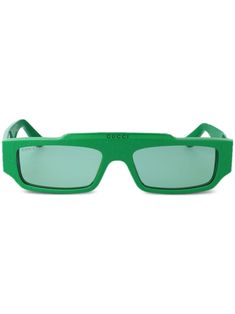 green recycled acetate signature GG print dial rectangle frame logo print to the front green tinted lenses straight arms curved tips These glasses come with a protective case. This item is made from at least 50% recycled or upcycled materials. For recycled synthetic clothing products, we highly recommend using a microfibre-catching washing bag to ensure that no microplastics that can pollute water are released in the process. Learn more about what makes a product Conscious on our Conscious Criteria page Frame Logo, Green Sunglasses, Gucci Eyewear, Rectangle Frame, Upcycled Materials, Eyewear Accessories, Colored Sunglasses, Sunglass Frames, Wash Bags