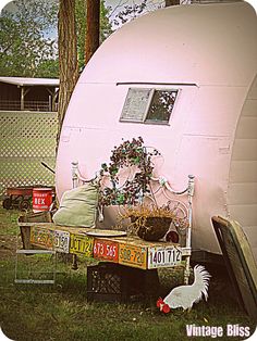 an old camper trailer has been converted into a bed for chickens and other things