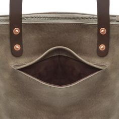 Whether you're running errands or looking to elevate your everyday style, our Eden Large Zippered Leather Tote Bag is the perfect companion. Crafted from premium full-grain US steerhide leather, this tote feels luxurious while offering exceptional durability. The 10 oz vegetable-tanned leather handles are designed to withstand daily use and provide added strength. The interior features soft, natural suede, with solid copper rivets adding a refined touch of elegance. With a secure zippered top fo Zippered Tote Bag, Sunglasses Light, Compact Umbrella, Large Leather Tote Bag, Leather Industry, Large Leather Tote, Everyday Tote, Zipper Tote Bag, Zippered Tote